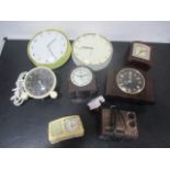 A collection of various clocks including Bakelite, wall clocks etc