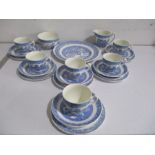 A blue and white willow pattern tea set