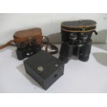 A pair of Kershaw binoculars with broad arrow mark along with another pair and a box camera