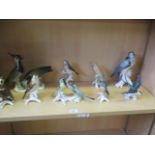 A collection of nine German figures of various birds