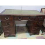 A reproduction kneehole desk