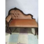 A small upholstered chaise lounge/ hall seat