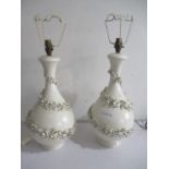 A pair of pottery lamps with embossed floral decoration marked Cassius, Spain, 45 cm height