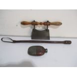 A vintage leather riding crop, treen handled cutter and a leather covered hip flask