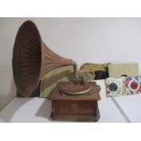 A wind up gramophone with horn and labelled 'Everything Under the Sun', registered trademarkalong