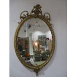 A Victorian oval gilt mirror