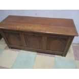 An oak coffer with carved decoration
