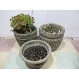 Three concrete garden pots