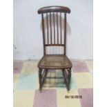 A Victorian cane seated rocking chair