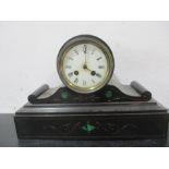 A black slate mantle clock with malachite detailing