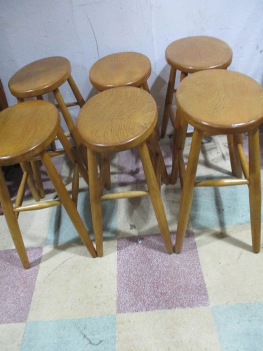 A set of six matched Ercol style stools