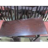 A mahogany extending dining table on pedestal base, with four chairs