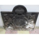 A large cast iron fire back