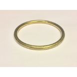 A 14ct gold bangle. Weight 11.5g