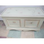 A blanket/toy box with painted decoration