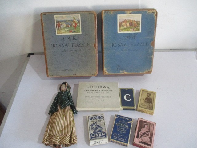 A selection of various games including playing cards, two GWR jigsaw puzzles, peg doll etc