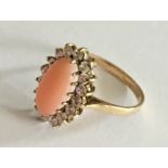 A 9ct gold coral and CZ dress ring
