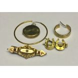 A 9ct gold locket, earring and brooches along with a gold coloured earring.Total weight 10g