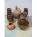 A collection of vintage terracotta flowerpots