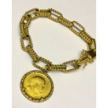 An 18ct gold bracelet set with a full 1909 sovereign- total weight 56.45g