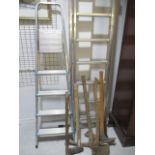 Two aluminium step-ladders, along with a small quantity of tools.