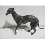 A cast metal figure of a greyhound, overall length 26cm