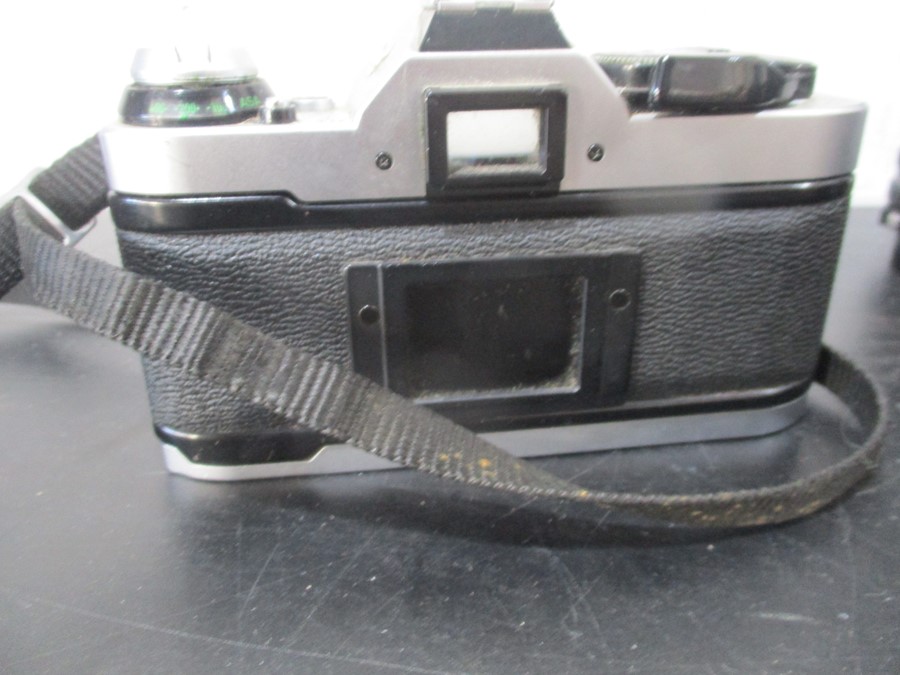 A Canon AE-1 camera with Canon and Pentax lenses - Image 6 of 11