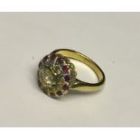 An 18ct gold ruby and diamond cluster ring