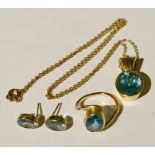 A 14ct gold topaz ring with a matching pendant and earrings set in 9ct gold.