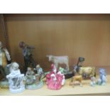 A collection of various figures including Beswick, Staffordshire, Royal Doulton, Wade Tom & Jerry