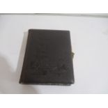 A leather bound Victorian photo album