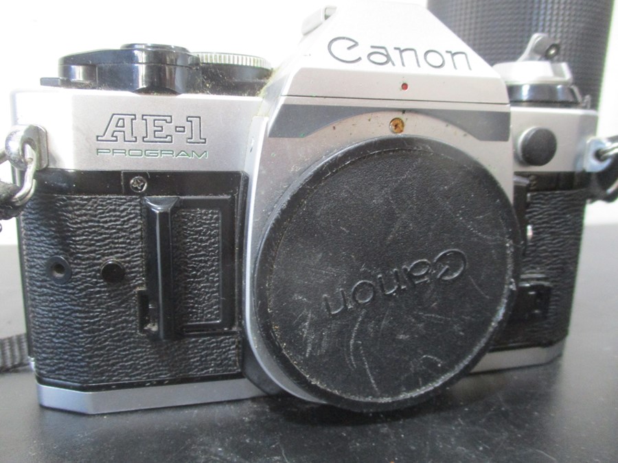 A Canon AE-1 camera with Canon and Pentax lenses - Image 2 of 11