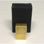 A cased gold plated Dupont lighter