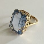 A large emerald cut topaz ring set in 9ct gold.