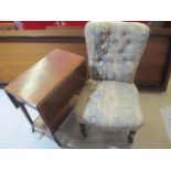 An upholstered nursing chair along with a Edwardian inlaid drop leaf table