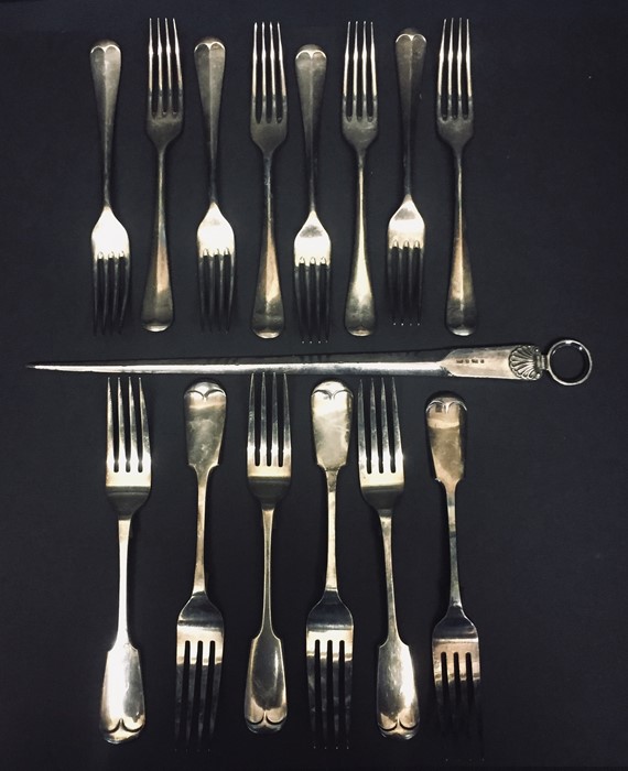 A silver plated meat skewer along with a quantity of cutlery.