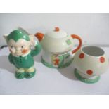 A Shelley "Boo Boo" nursery tea set consisting of teapot, jug and sugar bowl- tiny nick to rim of
