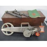 A vintage Singer hand held carpet sewing machine in oak box