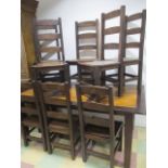 A large kitchen table and 8 ladder back chairs