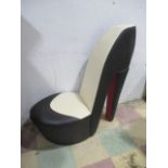 A stiletto chair in black white and red