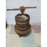 A wooden cider press