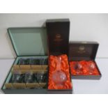 A Webb Continental boxed hand cut lead crystal decanter and brandy glasses, along with a boxed set