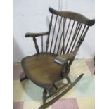 A dark wood rocking chair