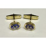 A pair of 14ct gold cuff links set with tanzanite. Total weight 5.2g