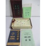 A wooden cased Mahjong set