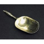 A Russian silver gilded caddy spoon, the back depicting St Petersburg.