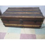 A wooden bound cabin trunk