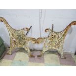 A pair of wrought iron bench ends