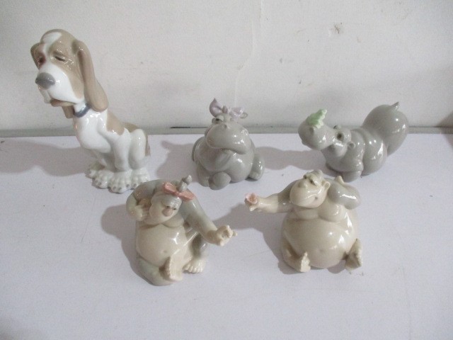 A selection of five boxed Nao comedic animal figurines.