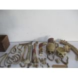 A disassembled part human skeleton including two skulls, spinal cord, femur etc